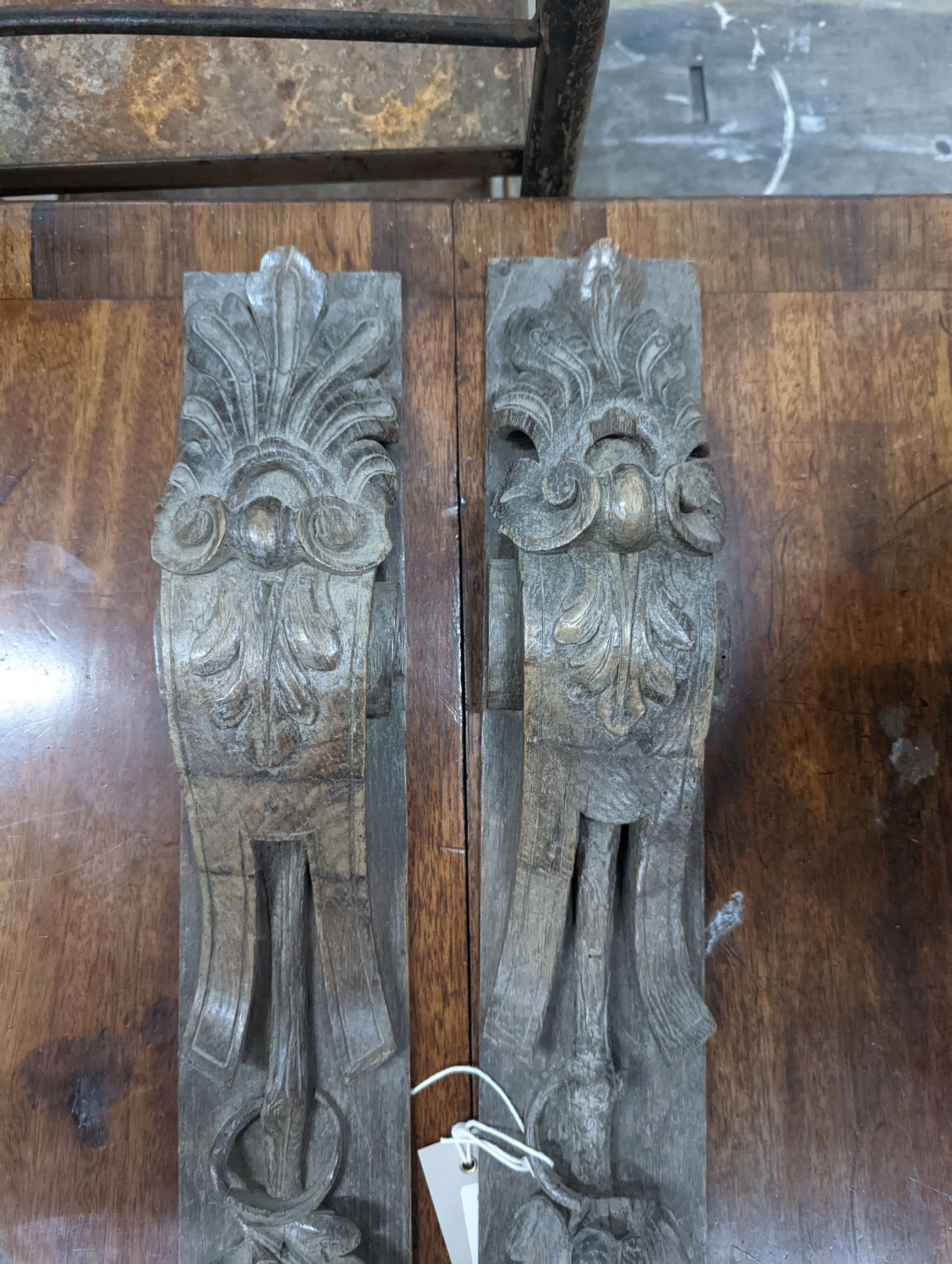 A pair of 19th century carved oak appliques, height 80cm
